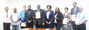 From Left: Ramesh Ghir; Sherwood Clarke; Gerhard Ramsroop; Minster of Public Infrastructure, David Patterson; Chairman of the Board, Stephen Fraser; Minister within the Ministry of Public Infrastructure, Annette Ferguson; Gillian Pollard; Nadia Jaikarran; Sherwood Clarke and Balraj Balram. 