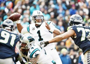  Carolina Panthers quarterback Cam Newton (1) throws the ball under pressure from Seattle Seahawks defensive end Michael Bennett (72) and Cassius Marsh (91) in the third quarter. (Kirby Lee-USA TODAY Sports)