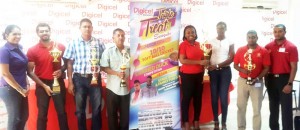 Digicel and GFSCA officials pose with the trophies that would be up for grabs on March 20. 