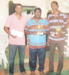  The special award recipients (from left) Khemraj Pooranmall, Mr. Jiaram and Paul D’Anjou display their accolades. 