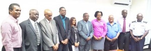 Ministers David Patterson and Annette Ferguson with the new Board members of GCAA yesterday. Fifth from left is new Chairman, Lawrence ‘Larry’ London.