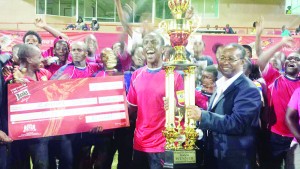 President of the GFA, Clifton Hicken (right), is just as happy as Riddim Squad’s Captain, Lyliton Ramsay, when he handed over the first place cheque and trophy.