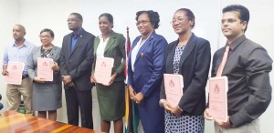 Ministers David Patterson (third left) and Annette Ferguson (third right) with some of the Board members.