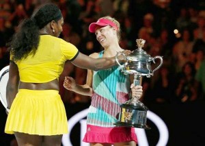 Germany’s Angelique Kerber (R) and Serena Williams of the U.S. speak as Kerber holds the trophy after winning their final match at the Australian Open tennis tournament at Melbourne Park, Australia, January 30, 2016. (Reuters/Thomas Peter)