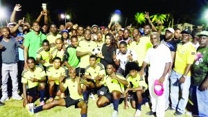 Ansa McAl PRO Ms. Darshanie Yussuf savouring the moment of victory with Grove Hi Tech’s Captain Sherman Doris and teammates following their win over Ann’s Grove in the final at the golden Grove ground on New Year’s night.