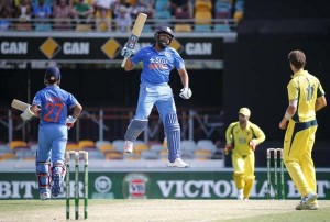 India’s Rohit Sharma (C) jumps as he celebrates reaching his century during the second One Day International cricket match against Australia in Brisbane January 15, 2016.  (Reuters/Glenn Hunt/AAP)