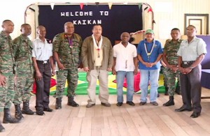 4th from left- Chief-of-Staff, Brigadier Mark Phillips, Adviser to Minister Allicock, Mervyn Williams, Ministers of Foreign Affairs, Carl Greenidge and Indigenous Peoples’ Affairs, Sydney Allicock, Guyana Defence Force, flanked by members of the joint service, during the visit to Kaikan, Region Seven.
