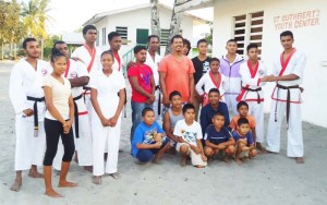 Members of the team that travelled for the launch and students of the St. Cuthbert’s Mission/Pakuri Martial Arts Academy take time out for a photo after the launch.