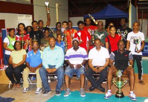 National Champs! GTTA President, Godfrey Munroe (second, right) and a Commissioner on the National Sports Commission, Nigel Hinds (third, left) join other GTTA Executives (seated), and various winners Sunday night following the National Championships.