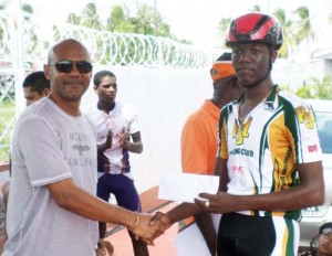 Romello Crawford receives his prize after winning in a time of 1:40:14.58.