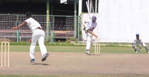 Sunil Singh tucks Robin Bacchus off his hips during his attractive 41 for TSC at Bourda yesterday.