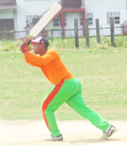 Trevus Drakes opens his arms during his innings against Crossbreed Warriors.