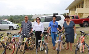 From left: Region Seven Chairman, Mr. Gordon Bradford, First Lady, Mrs. Sandra Granger, Ms. Sade Barton - Representative, Antarctic Maintenance and Repairs and Minister of Social Cohesion, Ms. Amna Ally with some of the bicycles which were handed out to students of Region Seven, today.
