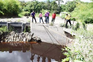  Staff of GWI and other agencies monitoring the water level of the EDWC.