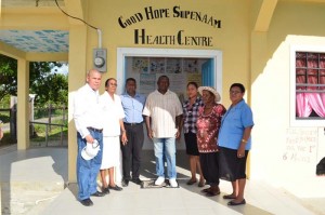 Mr. Maurice Bovell (center) along with Public Health Minister, Dr George Norton and other health care providers pose for a group photo after the handing over ceremony of the Good Hope, Supenaam Health Centre.