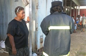 Manager Jocelyn Dow (left) is interviewed by a Fire Service official.