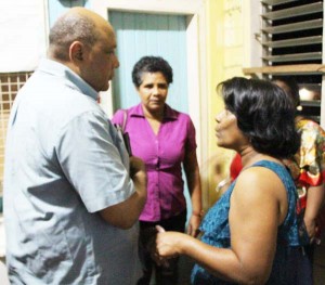 Minister of Natural Resources, Raphael Trotman, interacts with residents after the meeting on Sunday at Mahdia, Region 8.