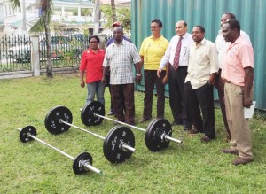  President of the GOA, Juman Yassin (4th R), joins Mr. Nurse (extreme R) and other officials at the handing over of the set of weights equipment.