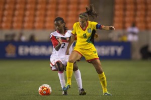 Ashley Rodrigues #9, Lady Jags Captain, battling Soca Princess Janelle Cunningham last night at the BBVA Compass Stadium. (CONCACAF photo)