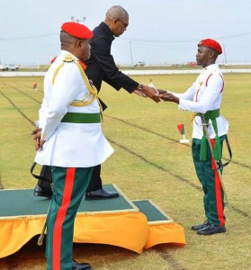  Best Student Second Lt Cleveroy Patrick collects the Sword of Honour from President David Granger.  