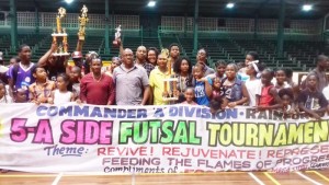  GFA President and Police Commander of ‘A’ Division, Clifton Hicken (about fifth left) poses with the winning Tiger Bay teams following the finals last weekend at the Cliff Anderson Sports Hall.