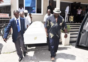 Members of the Bodybuilding and Weightlifting fraternity bears the remains of George Marshall out of the Merriman’s Funeral Home yesterday after a viewing. 