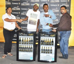 The two winners (centre) pose with their Coolers flanked by Banks DIH representatives on Tuesday night, at Pouderoyen Tarmac.