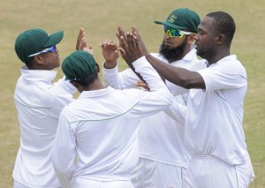 Guyana Jaguars celebrate on the third day of their 7th round match against Barbados Pride on February 21, 2016 at Kensington Oval. Photo by WICB Media/Randy Brooks of Brooks Latouche Photography