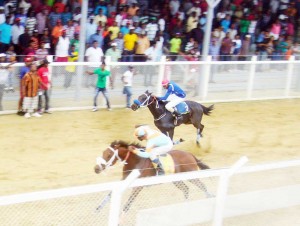 Midnight Blues of the Romell Jagmohan stables ridden by Nicholas Patrick winning the G and lower event from Settling Star of the Shariff stable.