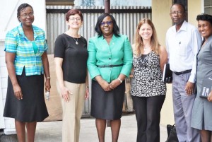  Minister Cummings (centre) in the company of Ministry officials and the visiting two-member team.
