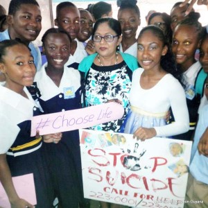 Mrs. Sita Nagamootoo flanked by students of the Central High School at the suicide awareness session.