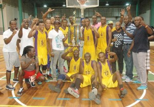 Flashback! Defending champion, Pacesetters pose with the Championship Trophy and supporters last year after winning the National Club Championship at the Cliff Anderson Sports Hall.