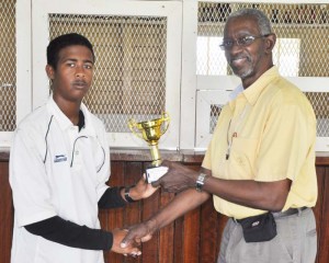 Jason Payne Collects his man-of-the-match prize from Match referee Grantley Culbard.