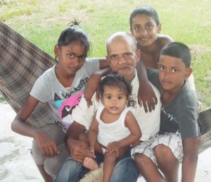 Rameshwar with his grandchildren in happier times.