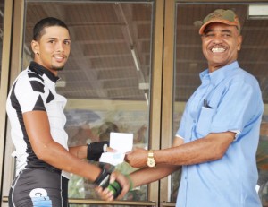 Overall winner Raul Leal collects his prize from one of the organisers.