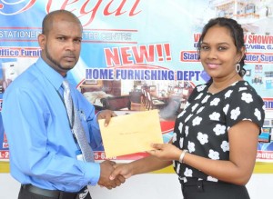 Abel Seetaram (left) of WBCA accepts the cheque from Telesha Ousman Yamin. 