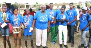 Retired Headmistress Ms. Wavney Dorsett (4th left) poses with the respective category winners.