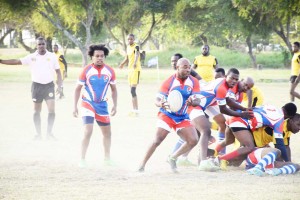 The Pepsi Hornets (with ball) attempts to control play during the GRFU 15’s action on Saturday in the National Park.