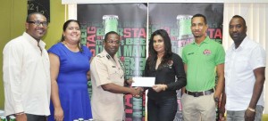 Ansa McAl PRO Ms. Darshanie Yussuf (3rd right) presents the sponsorship cheque to GFA President Commander Clifton Hicken in the presence of from right, Frank Parris, Sean Abel, Ms. Althea Scipio and Charles Greaves. 