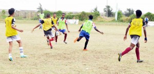 Action in one of the matches in this year’s Milo U-20 Schools Football Competition that was played yesterday at the Ministry of Education ground, Carifesta Avenue.