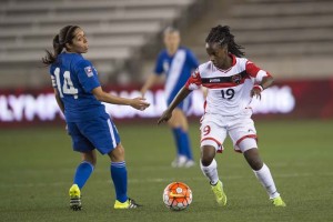 Trinidad and Tobago’s Kennya Cordner in control against Guatemala’s Coralia Monterroso in their CWOQC match last evening at the BBVA Compass Stadium. (CONCACAF photo)