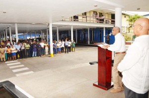 President David Granger addresses Banks DIH staff at Thirst Park.  Chairman of the Board of Directors and Managing Director, Clifford Reis is pictured at first, right.