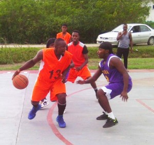 Action in the Ithaca Hardliners versus New Amsterdam Warriors clash in the Anamayah Memorial Basketball competition last Sunday.