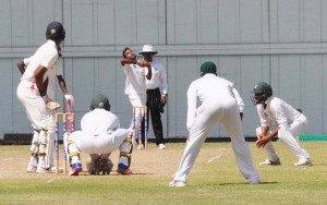 Veerasammy Permaul bowls to Roston Chase in Barbados yesterday.