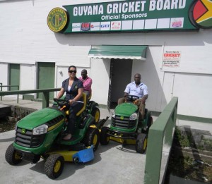 GCB Assistant Administrator Melinda Bishundyal-Chaitram, TDO Colin Stuart and Driver/Office Assistant Alexce Bobb testing out the Lawn Mowers. 