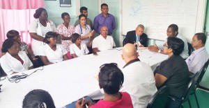  Public Health Minister Dr. George Norton (at head of table, on the left) along with hospital and regional officials at a media briefing yesterday.