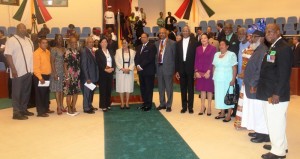 President David Granger (eighth from right), First Lady Sandra Granger at his immediate left, Acting Chancellor of the Judiciary Carl Singh at his immediate right, Prime Minister Moses Nagamootoo and his wife Sita Nagamootoo, flanked by recipients of the National Awards 