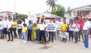 Church members took the streets with their placards urging villagers to stay alive. Pastor Ravindra Shivnandand is at the extreme right (white jersey)