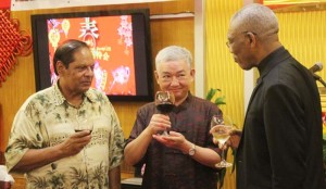 The Chinese Ambassador to Guyana, Zhang Limin (centre), toasting to the President, David Granger (right) and Prime Minister, Moses Nagamootoo at the 2016 Spring Festival Reception of the Chinese Embassy. 