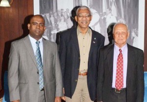 President David Granger (centre) is flanked by, left, IPED CEO, Ramesh Persaud and (right) Dr. Yesu Persaud, Chairman of Demerara Bank Limited and IPED. 